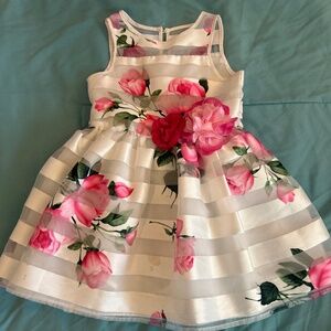 Sleeveless knee lenght dress with stripe background and floral design.
